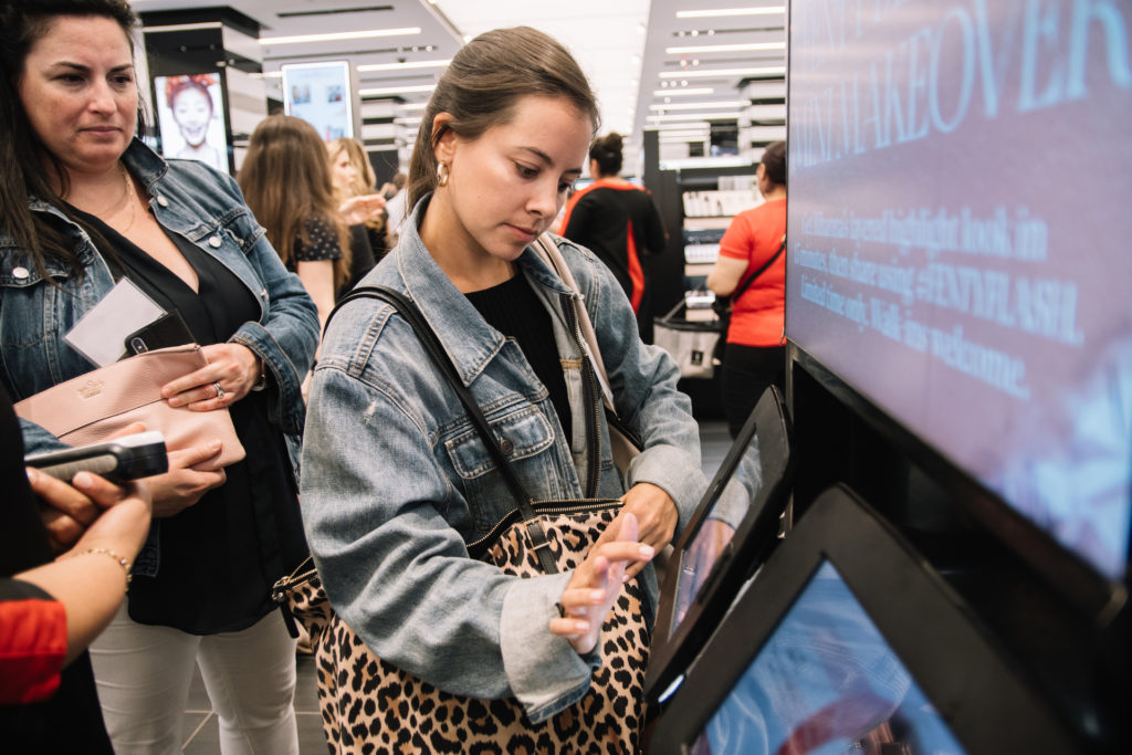 Two women using digital personalization kiosk at Sephora
