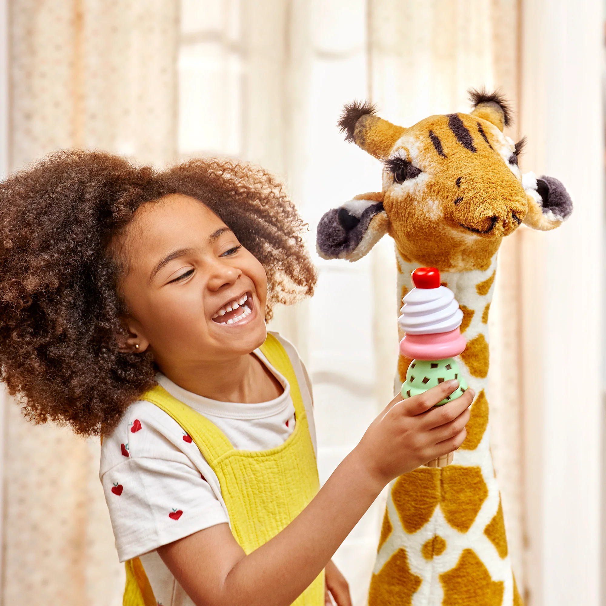 Child playing with stuffed animal